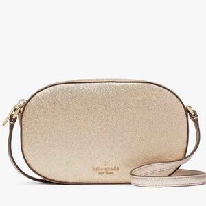 Kate Spade Glimmer Oval Camera Crossbody Bag in Gold
